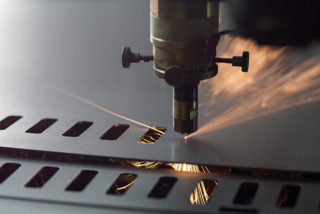 Image of a machine using ShapeNest profile cutting software and fabricating a profile